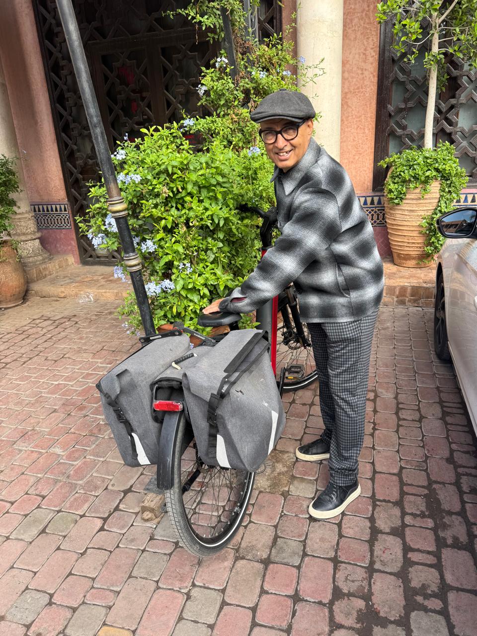 Jamal with e-bike in traditional setting