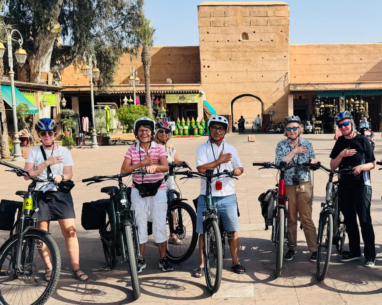 Tour group with e-bikes in traditional setting